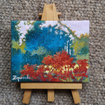 small landscape painting on tiny easel