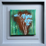green background and delicate tree in blue against area of rusted powder
